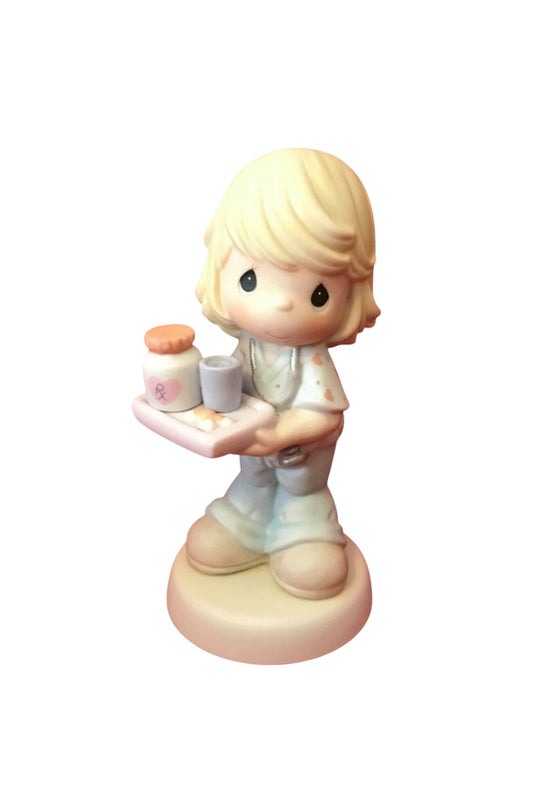A Nurse's Care Is The Best Medicine - Precious Moment Figurine